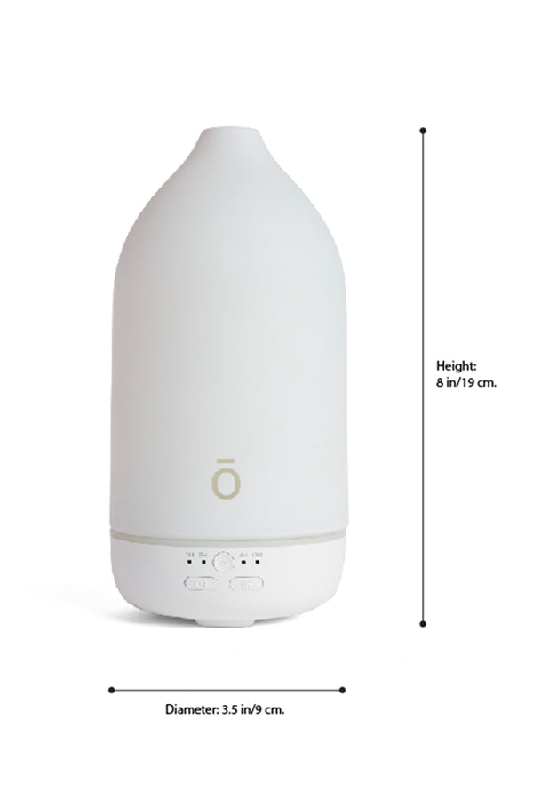 A white essential oil diffuser with dimension markings showing a height of 8 in (19 cm) and a diameter of 3.5 in (9 cm) on a white background. dōTERRA Laluz Diffuser with Lemon and Lavender