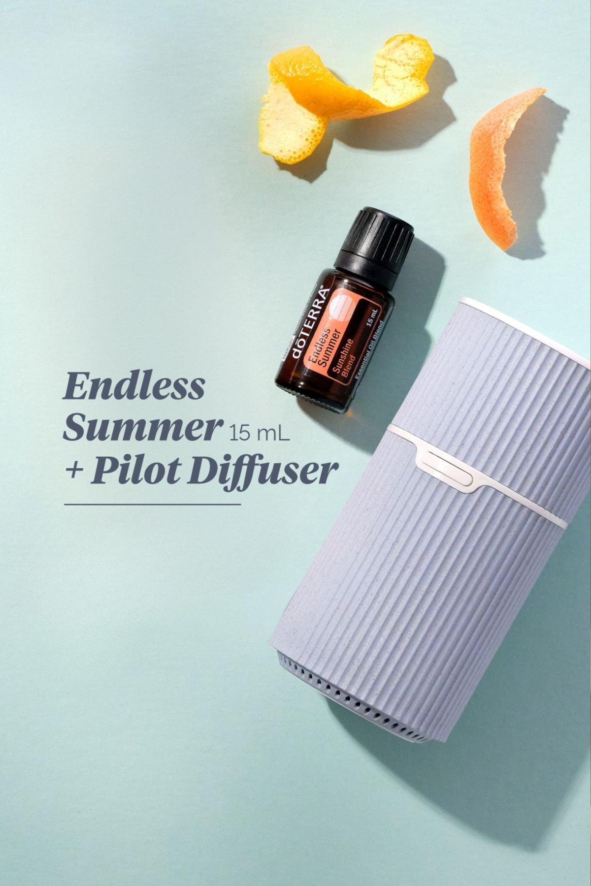 doTERRA Endless Summer essential oil bottle with a Pilot diffuser on a light blue background.