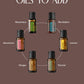 A promotional graphic on a muted brown background with the text 'POPULAR OILS TO ADD' above six small essential oil bottles arranged in a circle. The labeled bottles include Rosemary, RevitaZen, Lemon, Fennel, Ginger, and Geranium. doTERRA Castor Oil Canada