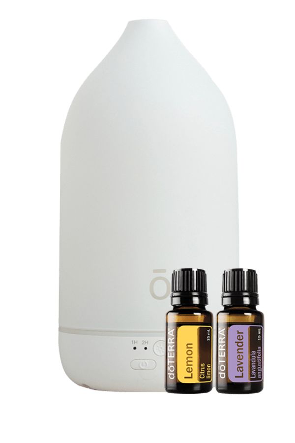 A white diffuser bottle with two small essential oil bottles labeled Lemon and Lavender, shown on a clean white background. dōTERRA Laluz Diffuser with Lemon and Lavender